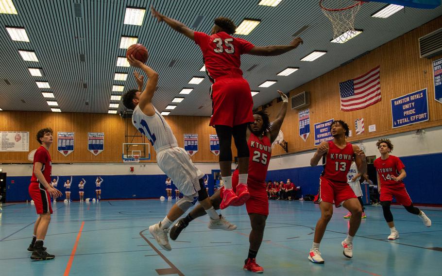 Kaiserslautern's Tre Dotson blocks a shot during a basketball game against Ramstein at Ramstein High School, Germany, Dec. 17, 2019. Ramstein won the game 72-56. 