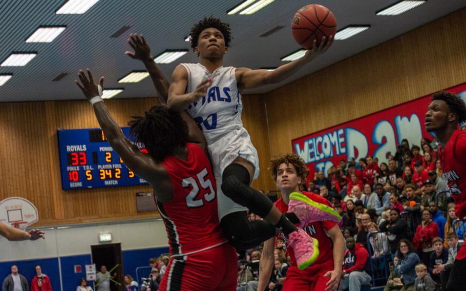 Ramstein's Jerod Little drives to the basket during a basketball game against Kaiserslautern at Ramstein High School, Germany, Dec. 17, 2019. Ramstein won the game 72-56. 

