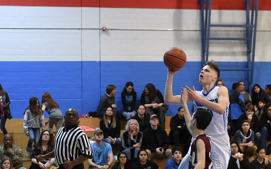 Hohenfels' Deshawn Herold-Adams shoots a layup during Friday's boys basketball game versus the AFNORTH Lions, which was held at Hohenfels. The Tigers beat the Lions 59-28.  
