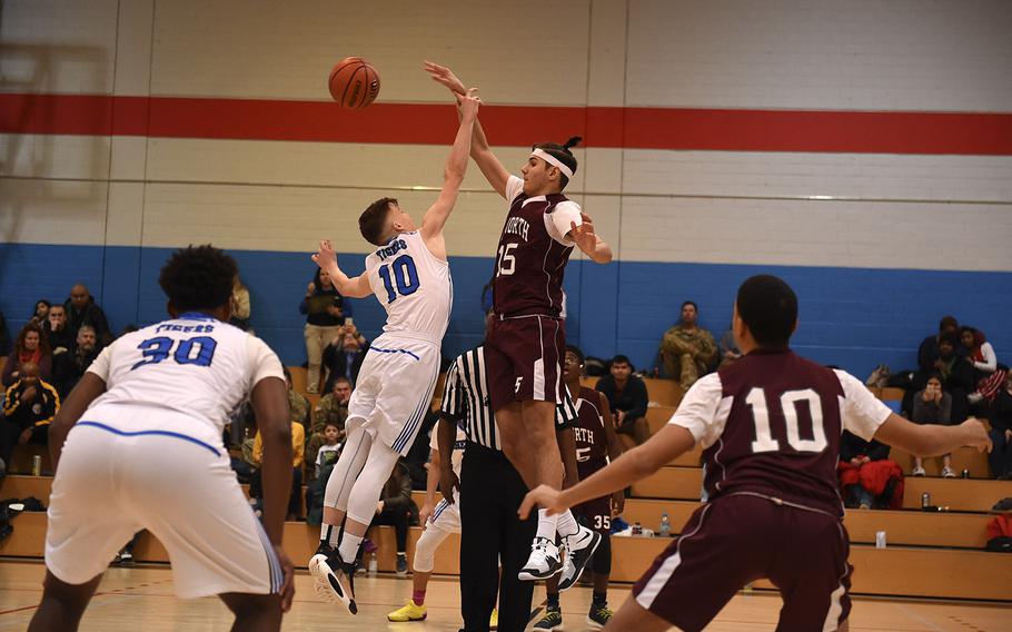 The Hohenfels Tigers and AFNORTH Lions' boys basketball teams tip-off at Friday's game, which was held at Hohenfels. The Hohenfels Tigers came out victorious in the game. 