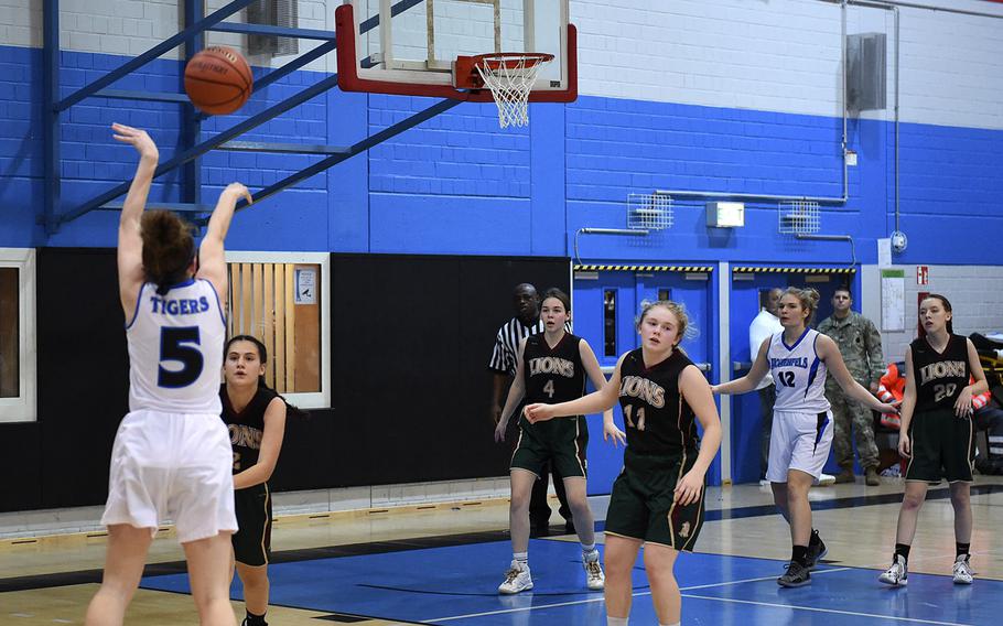 Karlie Perez from Hohenfels shoots the ball during Friday's game between AFNORTH's and Hohenfels' girls varsity basketball teams, which was held at Hohenfels. The AFNORTH Lions won the game. 