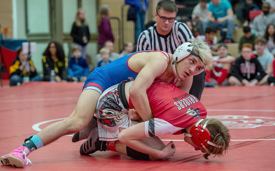 Ramstein's Conner Mackie takes down Kaiserslautern's Brandon Patterson during a wrestling tournament at Kaiserslautern High School, Germany, Saturday, Jan. 18, 2020. Mackie won the watch with a pin.  