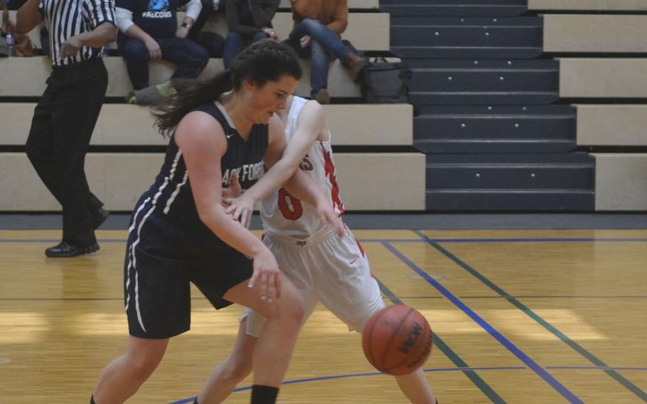 A Black Forest Academy player steals the ball from Lakenheath's Jenna Bills during a game played at Wiesbaden High School. The Falcons beat the Lancers 36-20. 