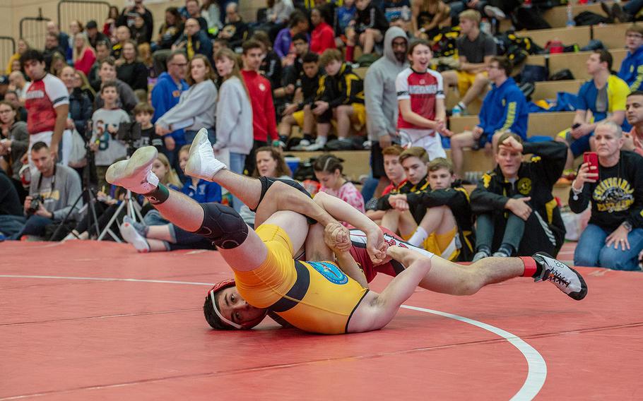 Kaiserslautern's Danny Aldana pins Stuttgart's Carter Hanes during a wrestling tournament at Kaiserslautern High School, Germany, Saturday, Jan. 18, 2020. 