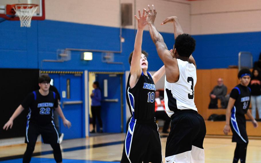 Spangdahlem Sentinel Deon Montgomery prepares to shoot the ball during Saturday's boys varsity basketball game against the Hohenfels Tigers, held at Hohenfels. The Sentinels beat the Tigers 69-60.