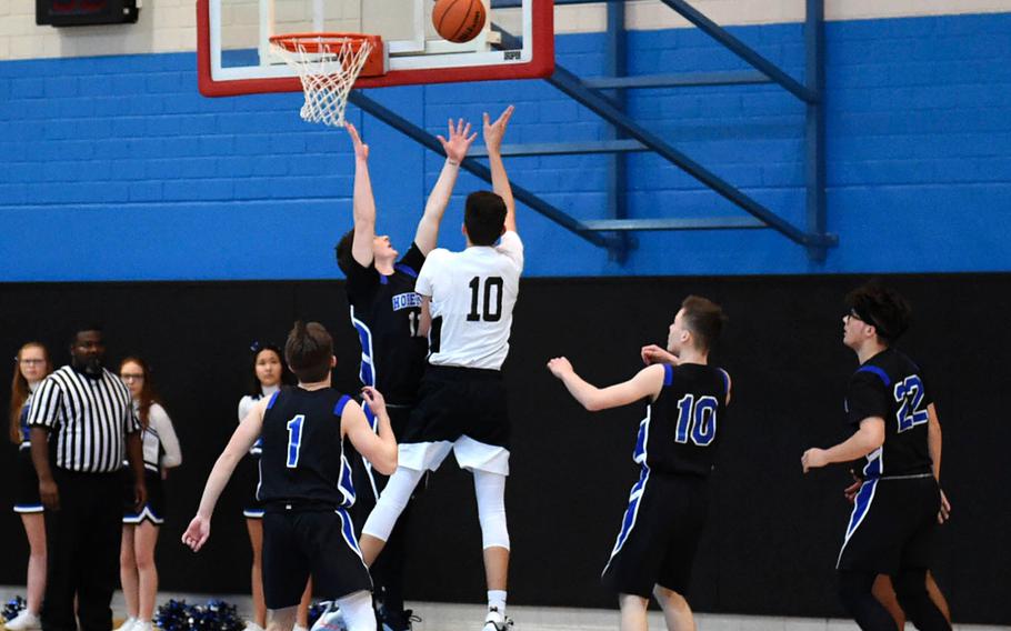 Spangdahlem Sentinel Alden Vasquez prepares to shoot the ball during Saturday's boys varsity basketball game against the Hohenfels Tigers, held at Hohenfels. The Sentinels beat the Tigers 69-60.