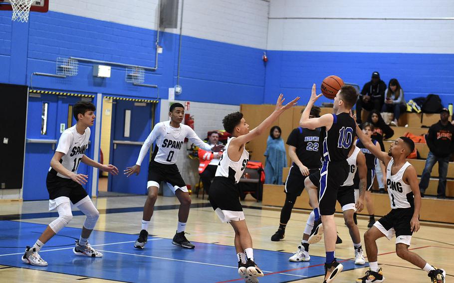 Hohenfels Tiger Deshawn Herold-Adams prepares to shoot the ball during Saturday's boys varsity basketball game against the Spangdahlem Sentinels, held at Hohenfels. The Sentinels beat the Tigers 69-60.