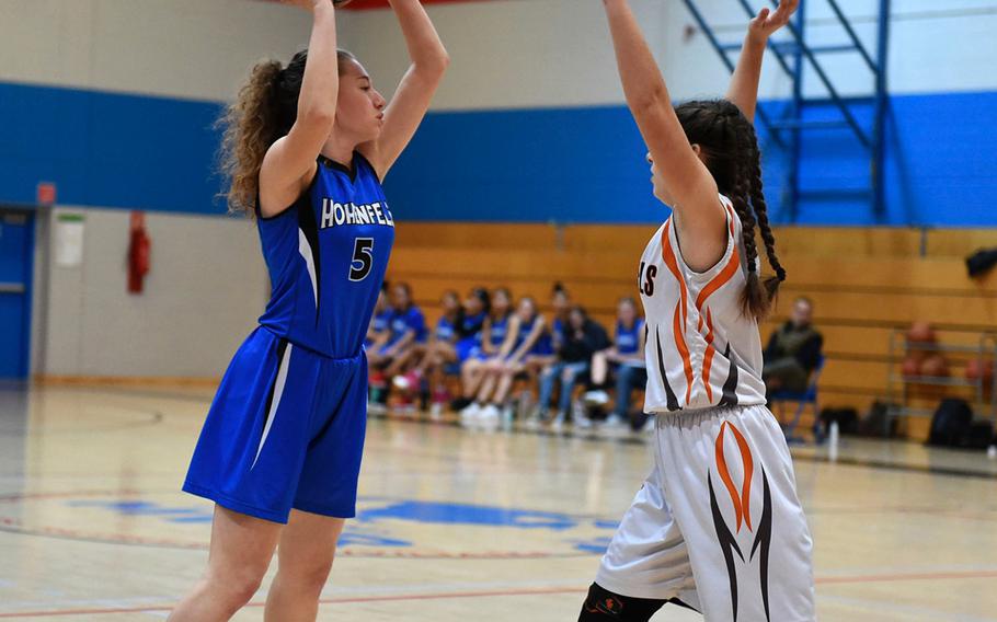 Hohenfels Tiger Rebecca Dick prepares to shoot the ball during Saturday's girls varsity basketball game, between the Hohenfels Tigers and the Spangdahlem Sentinels, held at Hohenfels. The Sentinels beat the Tigers 41-39.
