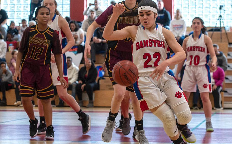 Ramstein's Thais Medina controls the ball during Saturday's girls varsity basketball game against Baumholder, held at Baumholder. Ramstein won the game 42-9.