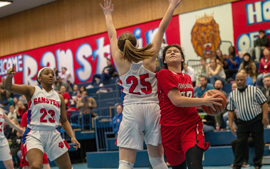 Kaiserslautern's Audrey Elisondo drives past a defender during a basketball game against Ramstein at Ramstein High School, Germany, Friday, Feb. 7, 2020. Ramstein won the game 34-30.  