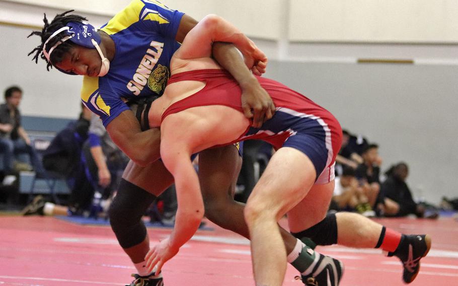 Sigonella's Amari Pyatt attempts to take down Aviano's Nick Smith in the first-place match at the 170-pound weight class of Saturday's Wrestling Sectionals held at Aviano, Italy. Pyatt pinned Smith for the win and that brings Pyatt's record to 19-0 going into the Euros.