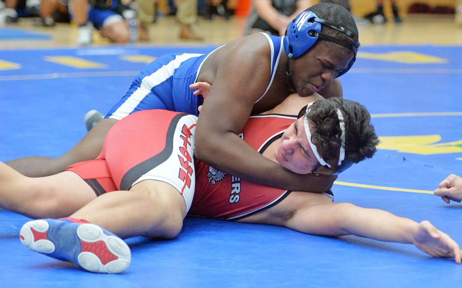 Rota's Isaac Hagood, top, tries to turn Kaiserslautern's Ty Quinto in a 195-pound match at the DODEA-Europe wrestling championships in Wiesbaden, Germany, Friday, Feb. 14, 2020. Hagood won.