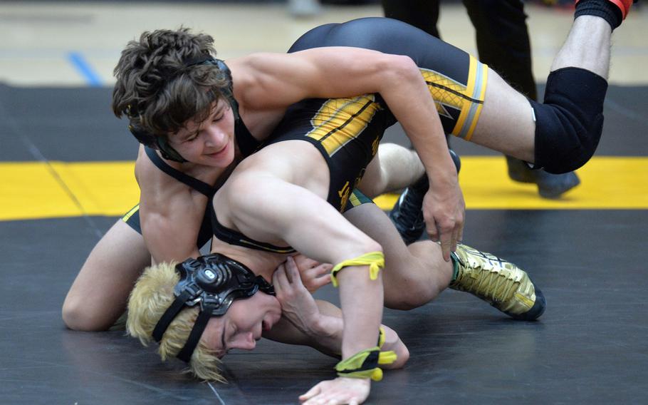 Alconbury's Becker Dunscombe, left, grapples with Stuttgart's Ivan Centeno in a 126-pound match on the first day of the DODEA-Europe wrestling championships in Wiesbaden, Germany, Friday, Feb. 14, 2020. Centeno won the close match 10-9.