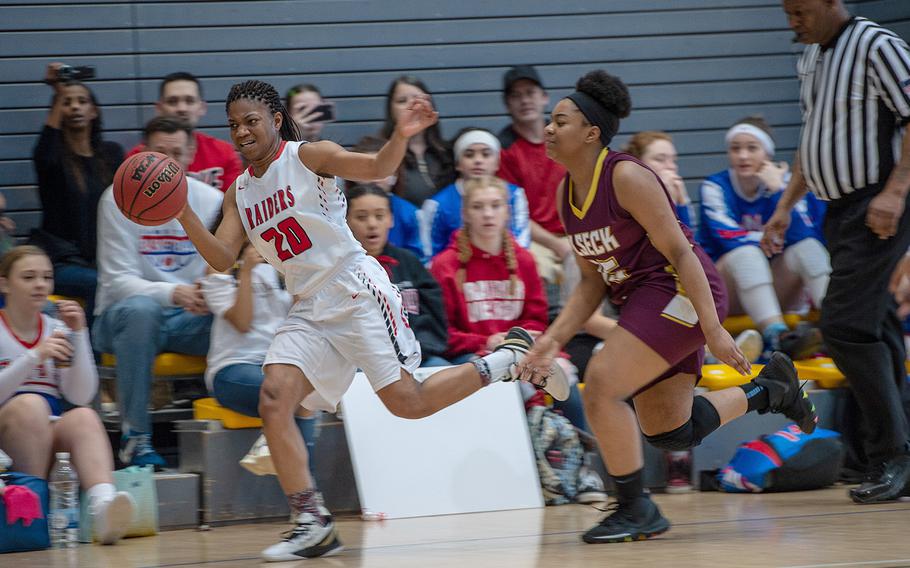 Kaiserslautern's Azora Williams tries to keep the ball inbounds after a steal during a game against Vilseck during the DODEA-Europe 2020 Division I basketball playoffs at the Southside gym on Ramstein Air Base, Germany, Thursday, Feb. 20, 2020.