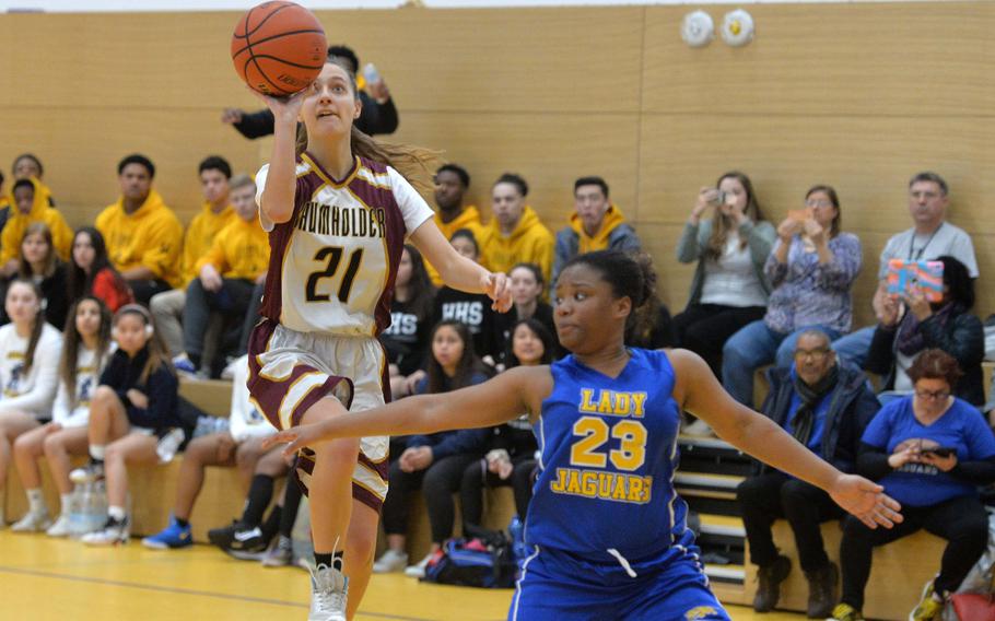 Lydia Coyour of Baumholder shoots over Sigonella's Jalissa Leejay in a Division III game at the DODEA-Europe basketball championships in Wiesbaden, Germany, Thursday, Feb. 20, 2020. The Jaguars won 27-26.