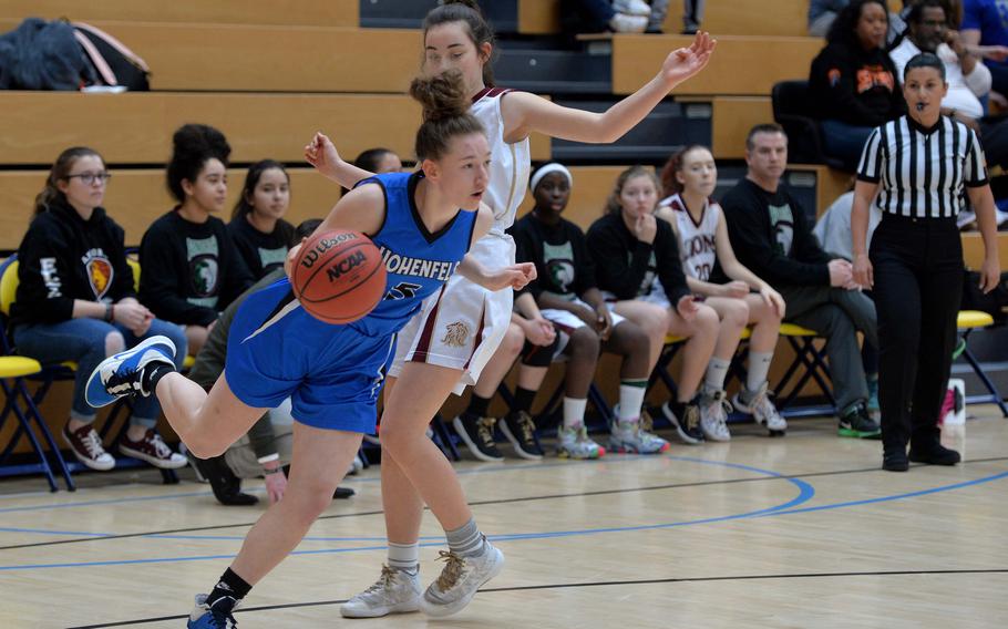 Karlie Perez of Hohenfels drives past Paula Bohlen of AFNORTH in a Division III semifinal at the DODEA-Europe basketball championships in Wiesbaden, Germany, Friday, Feb. 21, 2020. Hohenfels beat AFNORTH 36-31 to advance to the finals.