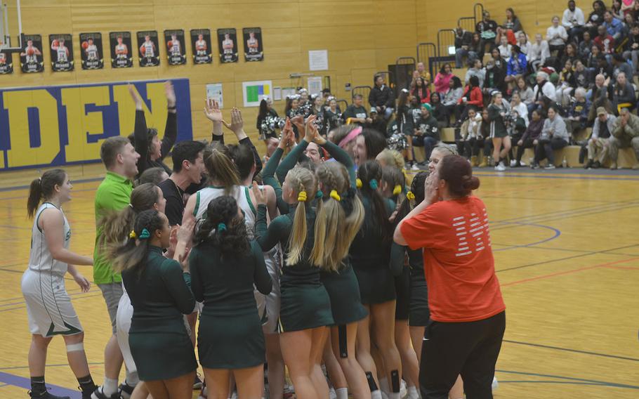 SHAPE players and fans celebrate advancing to the school's first Division I basketball final after the Spartans defeated Ramstein 36-24, in Wiesbaden High School on Friday, Feb. 21, 2020. 