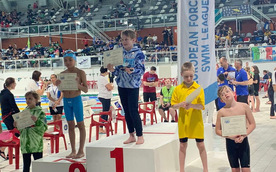 Kaiserslautern swimmer Jacob Furqueron, center, placed first for the boys 9-year-old pentathlon (that consisted of freestyle, backstroke, breaststroke, butterfly and the individual medley) during the European Forces Swim League championships in Eindhoven, Netherlands, Saturday, Feb. 29, 2020.