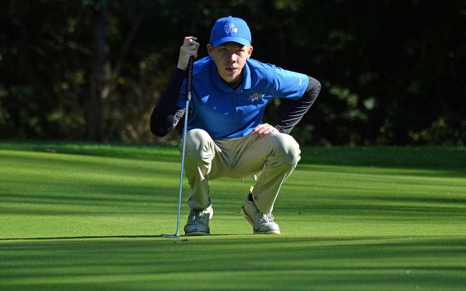 Defending boys champion Clayton Shenk of Wiesbaden studies the green before making a putt during opening day action at the DODEA-Europe golf championships at Rheinblick Golf Course in Wiesbaden, Germany, Wednesday, Oct. 7, 2020.