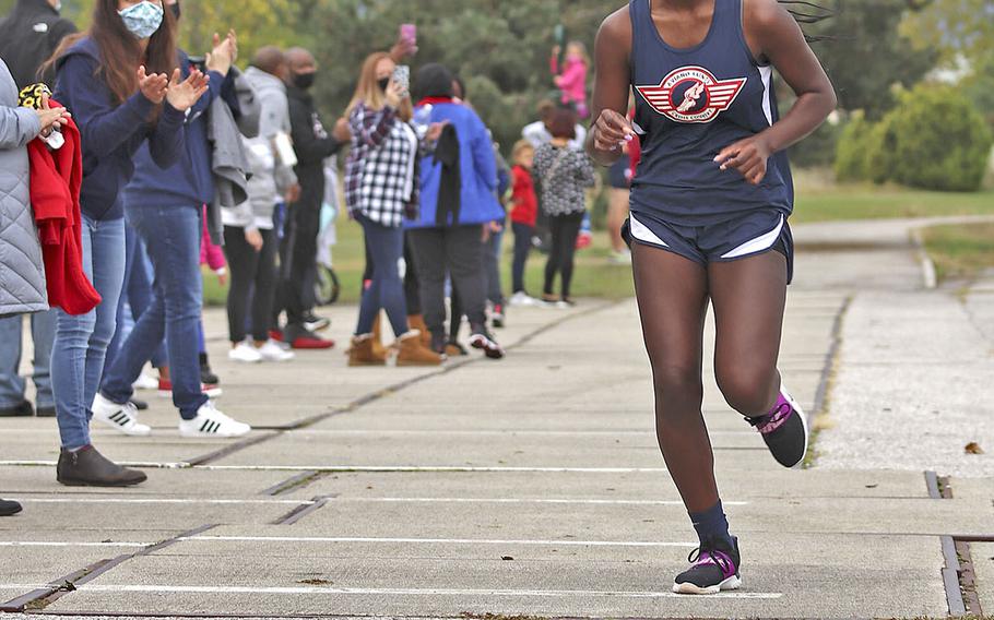 Zurnia Dickerson approaches the finish line during Saturday's cross country meet at Aviano. 