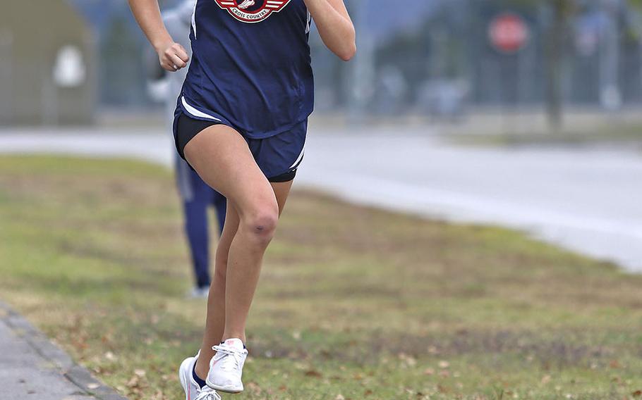 Halie Carroll sprints to the finish line during Saturday's cross country meet at Aviano. Carroll finished with a time of 25 minutes, 29 seconds.