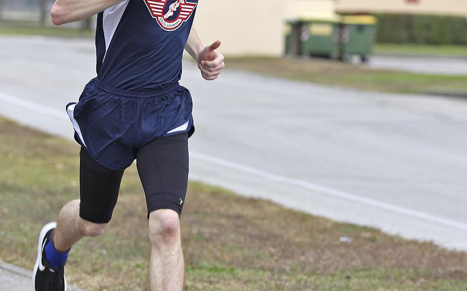 Nick Altland sprints to the finish line during Saturday's cross country meet held at Aviano. Altland finished in a time of 23 minutes, 24 seconds.