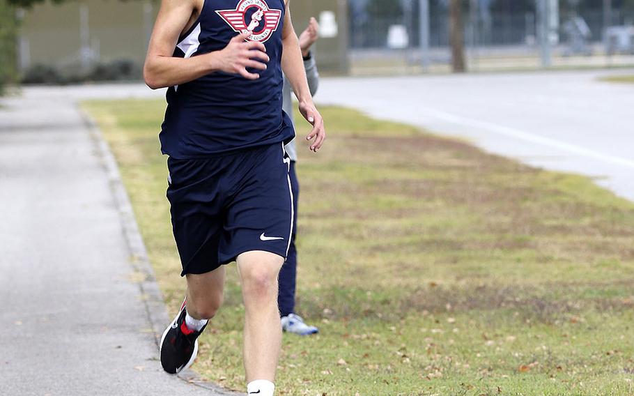 Trenton Bouchard finishes up his run during Saturday's cross country meet at Aviano. Bouchard finished in third place with a time of 21 minutes, 15 seconds.