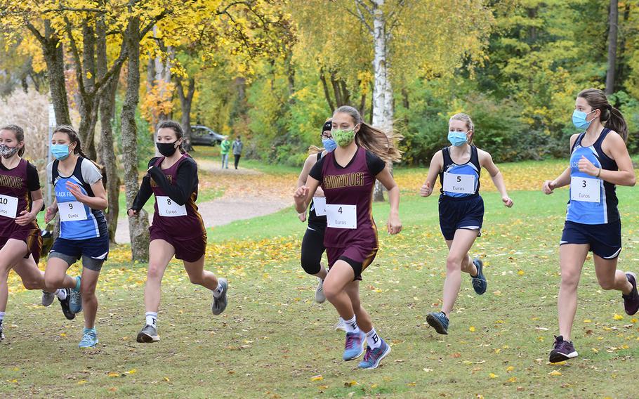 The start of the small schools' girls race at the DODEA-Europe non-virtual championship on Saturday, Oct. 24, 2020, featured teams from Baumholder, Black Forest Academy and Spangdahlem. Runners had to wear face masks at the start but could remove them after the race began. The meet was held at the Seewoog Park in Ramstein-Miesenbach, Germany.