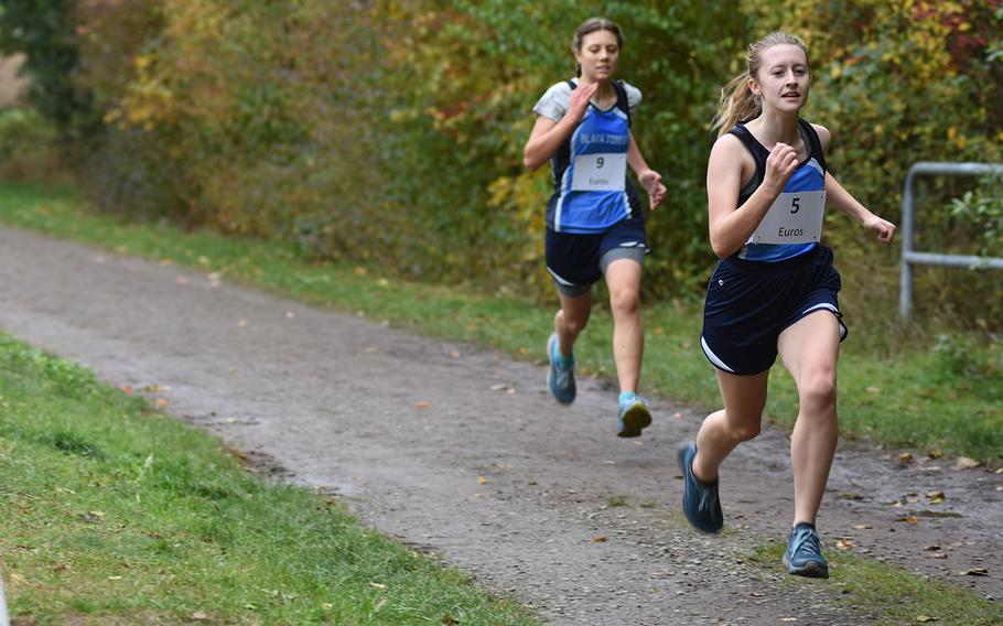 Black Forest Academy's Havelah Trusty leads teammate Carolyn Randles during the DODEA-Europe non-virtual cross country championship on Saturday, Oct. 24, 2020. BFA participated in the small schools' race with Spangdahlem and Baumholder.