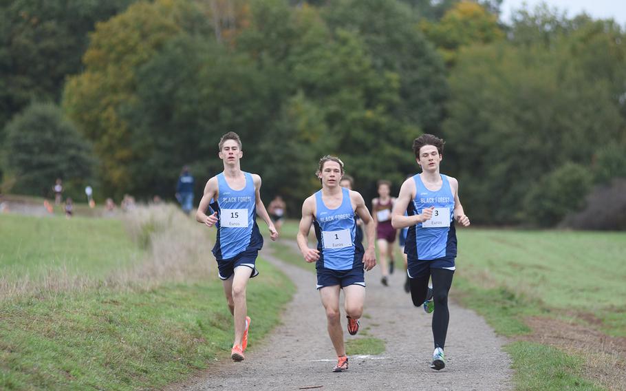 Black Forest Academy runners, from left, Colby Liesen, Kade Erickson and Josiah Alexander, lead the small schools boys race at the DODEA-Europe non-virtual cross country championships on Saturday, Oct. 24, 2020, at Ramstein-Miesenbach, Germany.