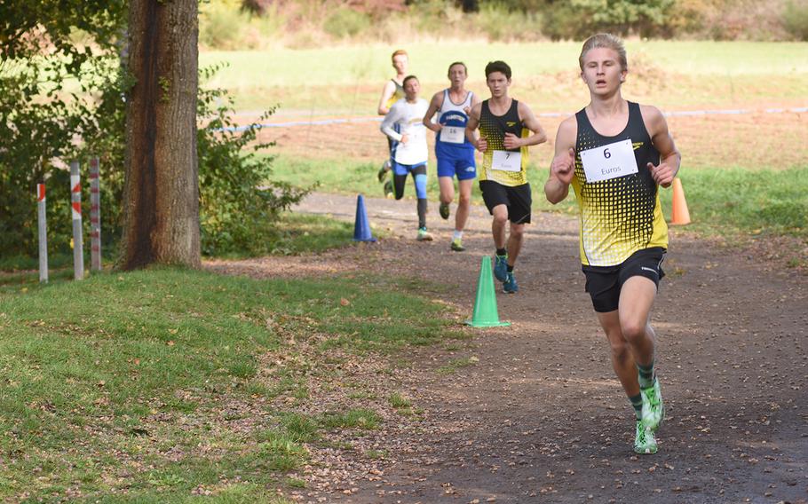 Stuttgart's Brice Brown turns the corner ahead of a group of runners at the DODEA-Europe non-virtual cross country championship on Saturday, Oct. 24, 2020, at Seewoog Park in Ramstein-Miesenbach, Germany. Brown finished fifth overall in the race.