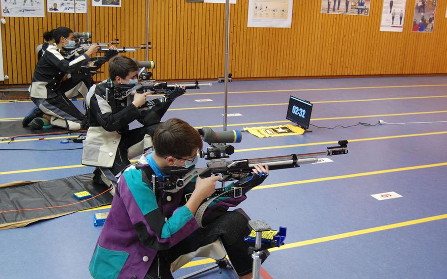 Judah Zaragoza, from right, Josh Thresher, Jaden Anderson and Lidia Mason compete in the kneeling position for Wiesbaden on Saturday, March 20, 2021, during the DODEA-Europe marksmanship championships.