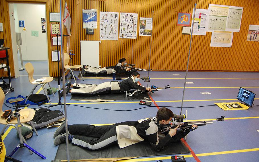 Josh Thresher, from right to left, Jaden Anderson and Lidia Mason fire from the prone position for Wiesbaden on Saturday, March 20, 2021, during the DODEA-Europe marksmanship championships.
