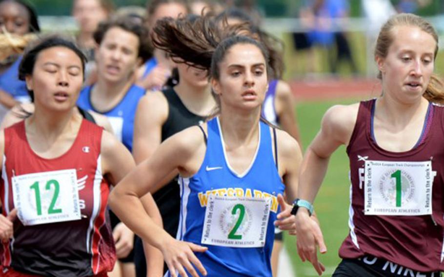 Runners head into the last lap of the girls 800-meter race at the 2019 DODEA-Europe track and field championships in Kaiserslautern, Germany, during the last time finals were held. Last year's track season was canceled due to the coronavirus. This year, the championships will only be virtual. 