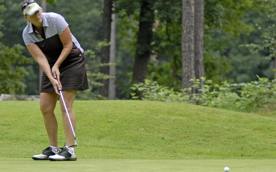 Pam Lewers, a civilian worker at Ramstein Air Base, putts towards the cup Thursday at Woodlawn Golf Club&#39;s 9th hole during the U,.S. Air Forces in Europe golf championships in Ramstein, Germany.