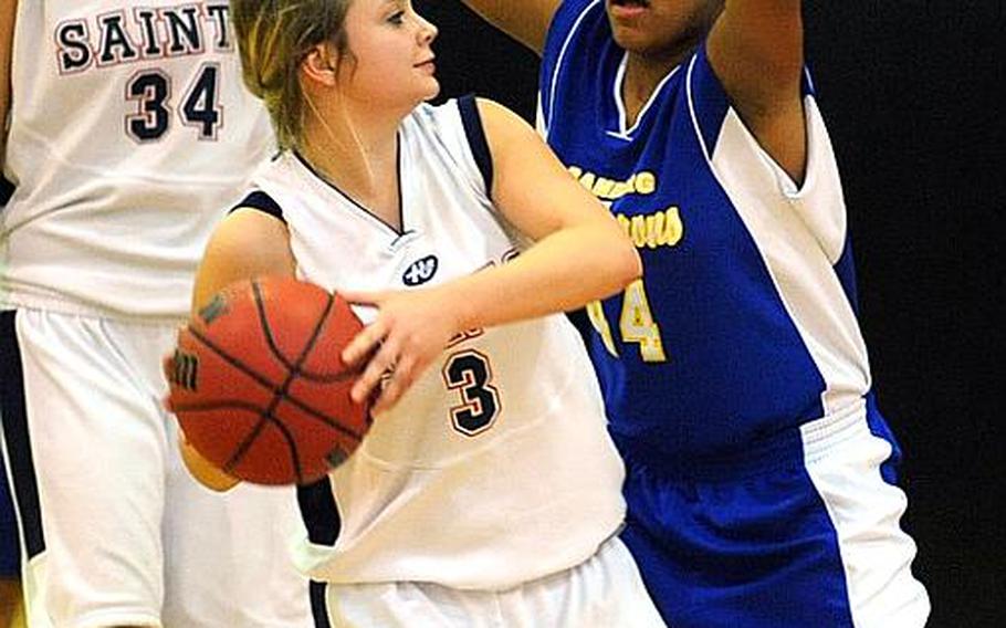 Bamberg's Julieka Medina, right, guards against Aviano's Casey Brunetti in an opening-day Division II game at the DODDS Europe basketball championships in Mannheim, Germany, on Wednesday. At left is Jasmine Mailoto. Top-seeded Aviano defeated the Lady Barons, who are seeded 10th, 39-20.