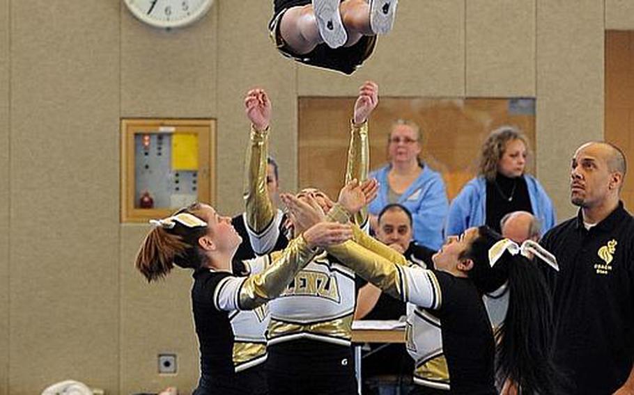 The Vicenza Cougars cheer team performs  at the  DODDS Europe Cheer Championships in Mannheim, Germany.