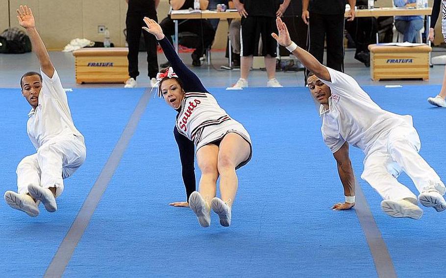 Members of the Aviano Saints cheer team perform at the DODDS Europe Cheer Championships in Mannheim, Germany.