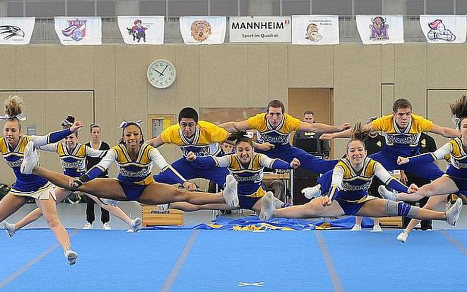 The Ansbach Cougars cheer team lift off at the  DODDS Europe Cheer Championships in Mannheim, Germany. The team took second in Division II.