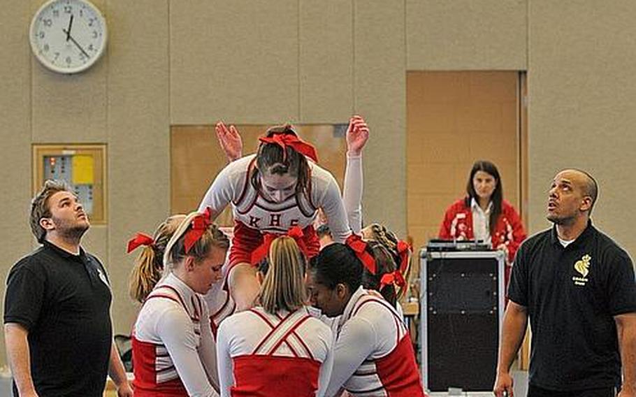 The Kaiserslautern Raiders cheer team do a stunt at the DODDS Europe Cheer Championships in Mannheim, Germany.