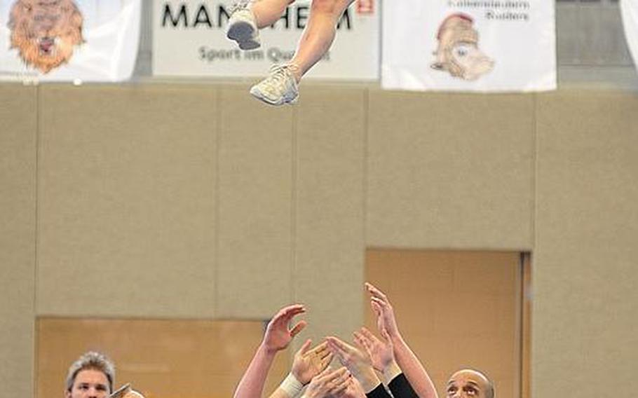 Members of the Patch Panthers cheer team get ready for a catch during competition at the DODDS Europe Cheer Championships in Mannheim, Germany.