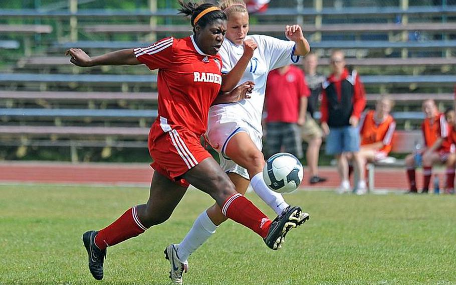 Kaiserslautern's Cariema Wood, left, defends against Ramstein's Shannon Guthrie in a game at Ramstein on Saturday. Ramstein won 6-1 in the final match for both teams before this week's DODDS-Europe championships.