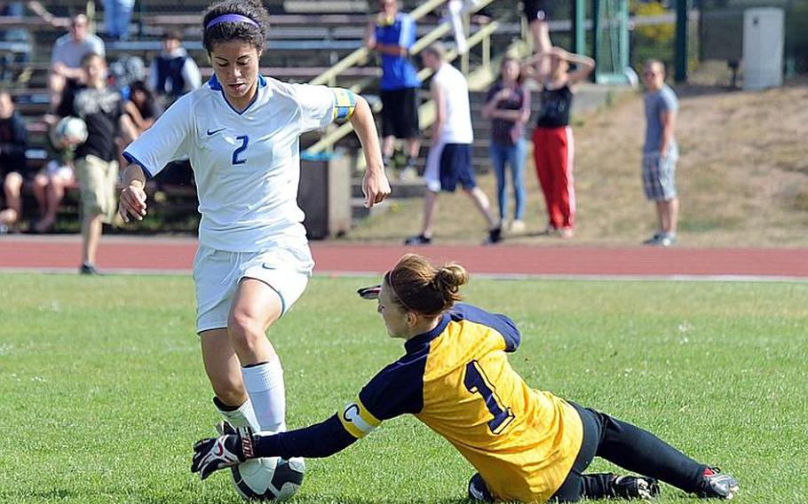 Kaiserslautern keeper Katie Jackson snatches the ball away from Ramstein's Josie Seebeck in the Raiders' 6-1 loss to Ramstein on Saturday.