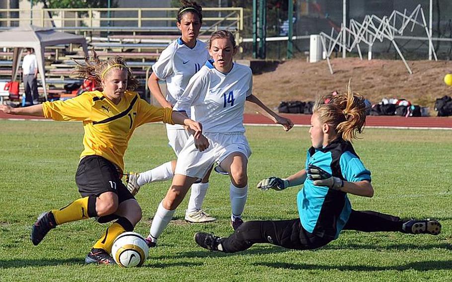 Ramstein keeper Terri Leigh Overmiller makes a risky save against Patch's Sydney Baer in the girls Division I final on Saturday. Patch beat Ramstein, 2-1, to defend its title. At center are Mackenzie Crews and Alexis Vermiere.