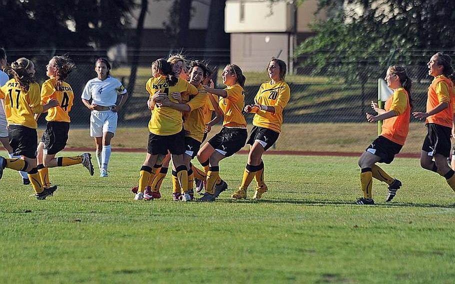 The Patch Lady Panthers celebrate their Division I girls soccer title repeat after defeating Ramstein, 2-1, in Ramstein on Saturday.