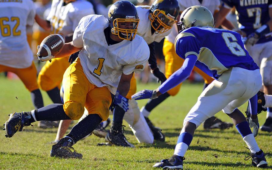 Heidelberg&#39;s Chris Cuthbert, left, looks Wiesbaden&#39;s Khari Bennett in the eyes as he picks up yardage in a game in Wiesbaden on Oct. 9, 2010. Cuthbert has been selected the 2011 DODDS-Europe male athlete of the year.