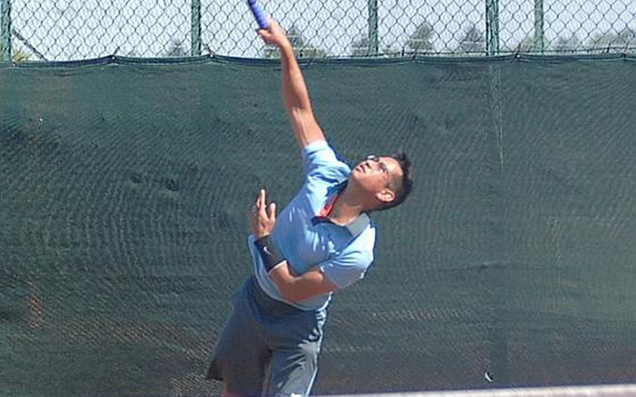 Phillip Ramil hits a serve during his three set victory Saturday over Brian Kelley in the final match of the U.S. Forces Europe Tennis Championships in Heidelberg, Germany.