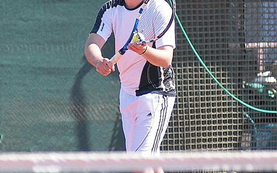 Brian Kelley serves in the second set of his match against Phillip Ramil in the finals of the men's Open division of the U.S. Forces Europe Tennis Championships. Though he pushed it to three sets, Kelley fell short in the third.