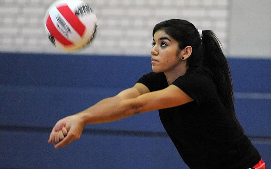 Kaiserslautern's Grace Gonzales concentrates as she passes the ball during a drill Aug. 14, 2012, at the volleyball camp in Vilseck, Germany.