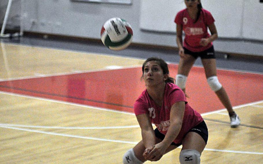 Aviano's Devin Franco bumps the ball to start the Saints offense Friday night in a volleyball match won by the American Overseas School of Rome, 25-14, 33-31, 25-15.